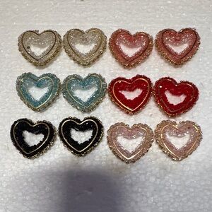 See if 12 Heart-Shaped Glitter Resin Earrings in Multiple Colors